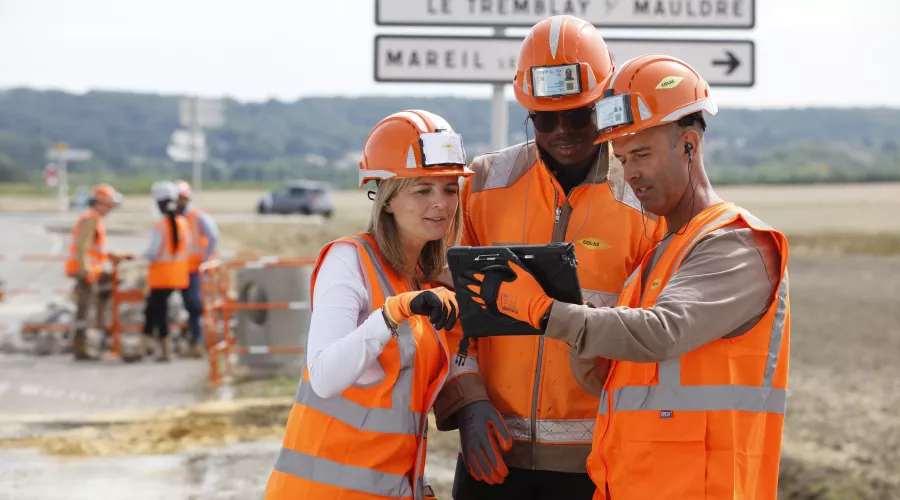 Team works on tablets